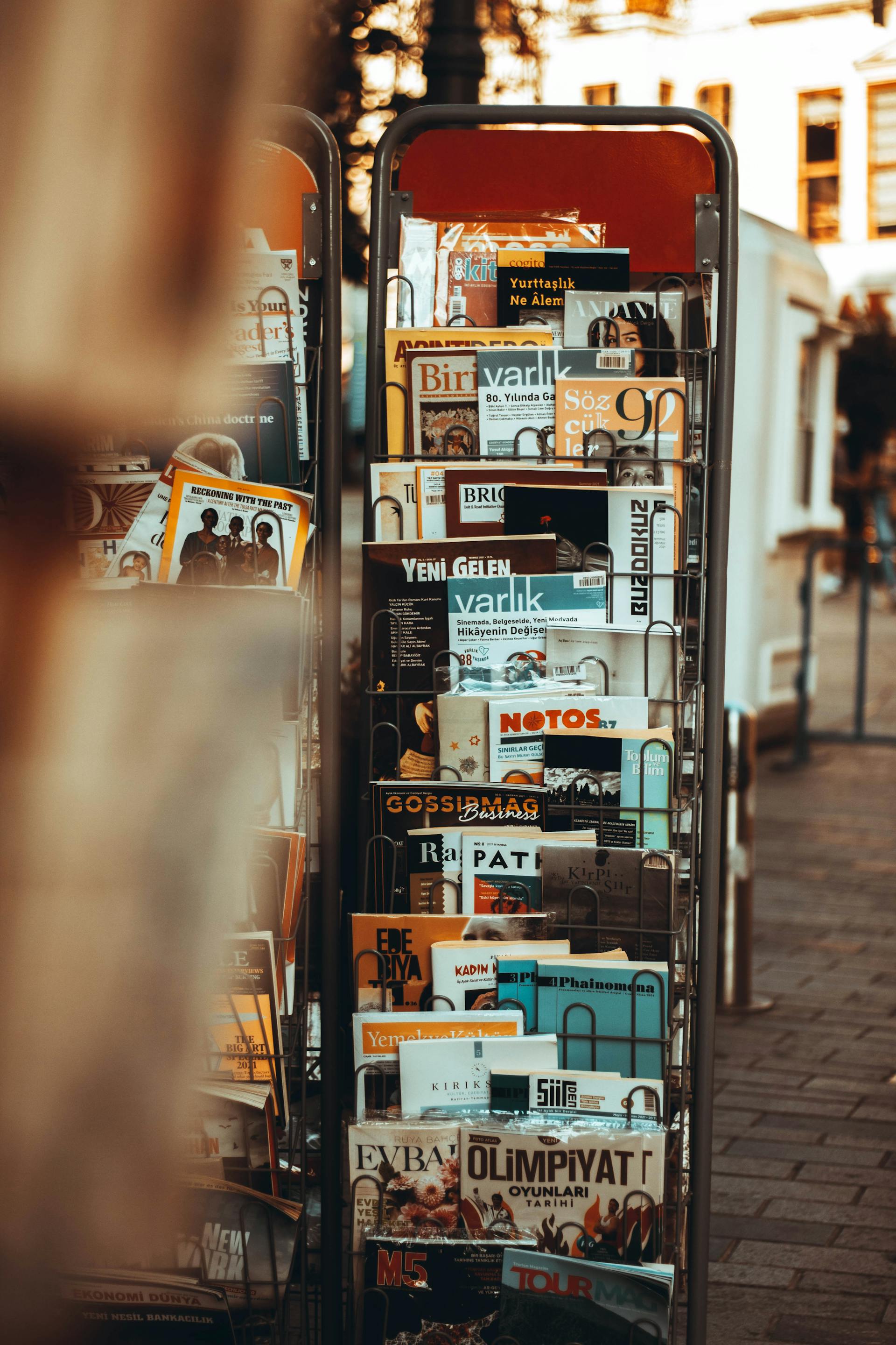 Magazine stand with several publications | Source: Pexels
