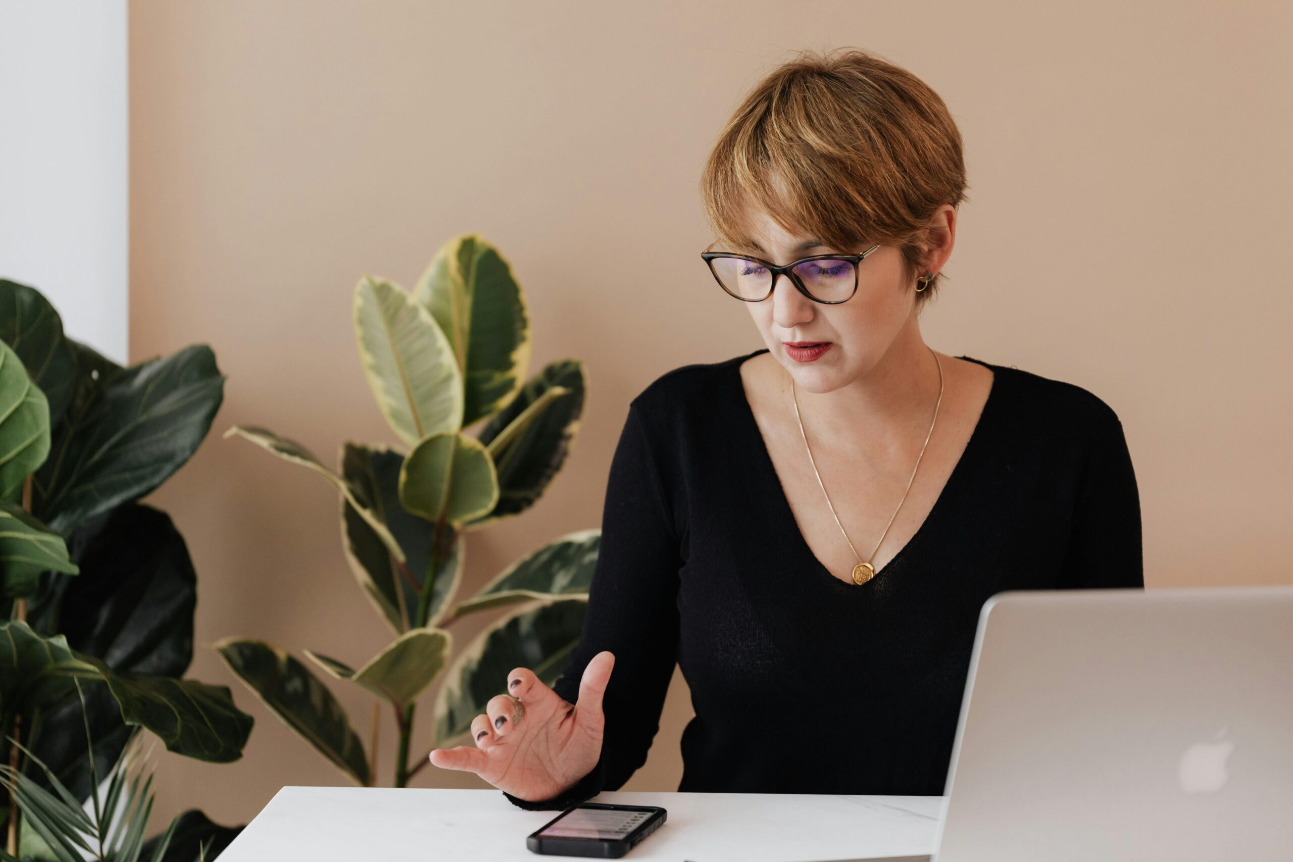 A woman looking at something on her phone | Source: Pexels