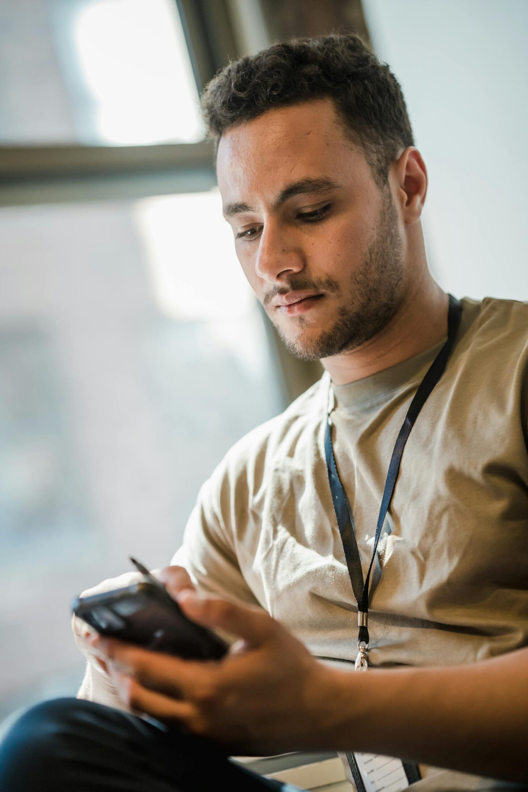 A man using his phone | Source: Pexels