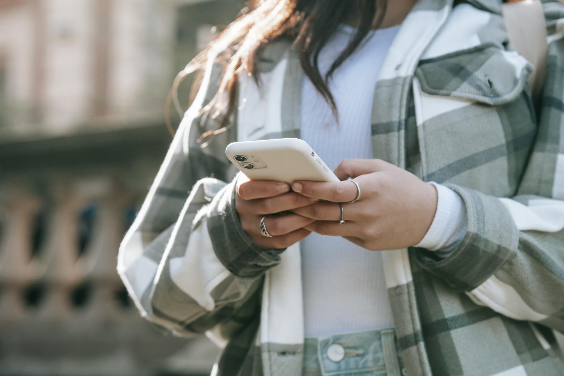 A close-up shot of a woman using her smartphone | Source: Pexels