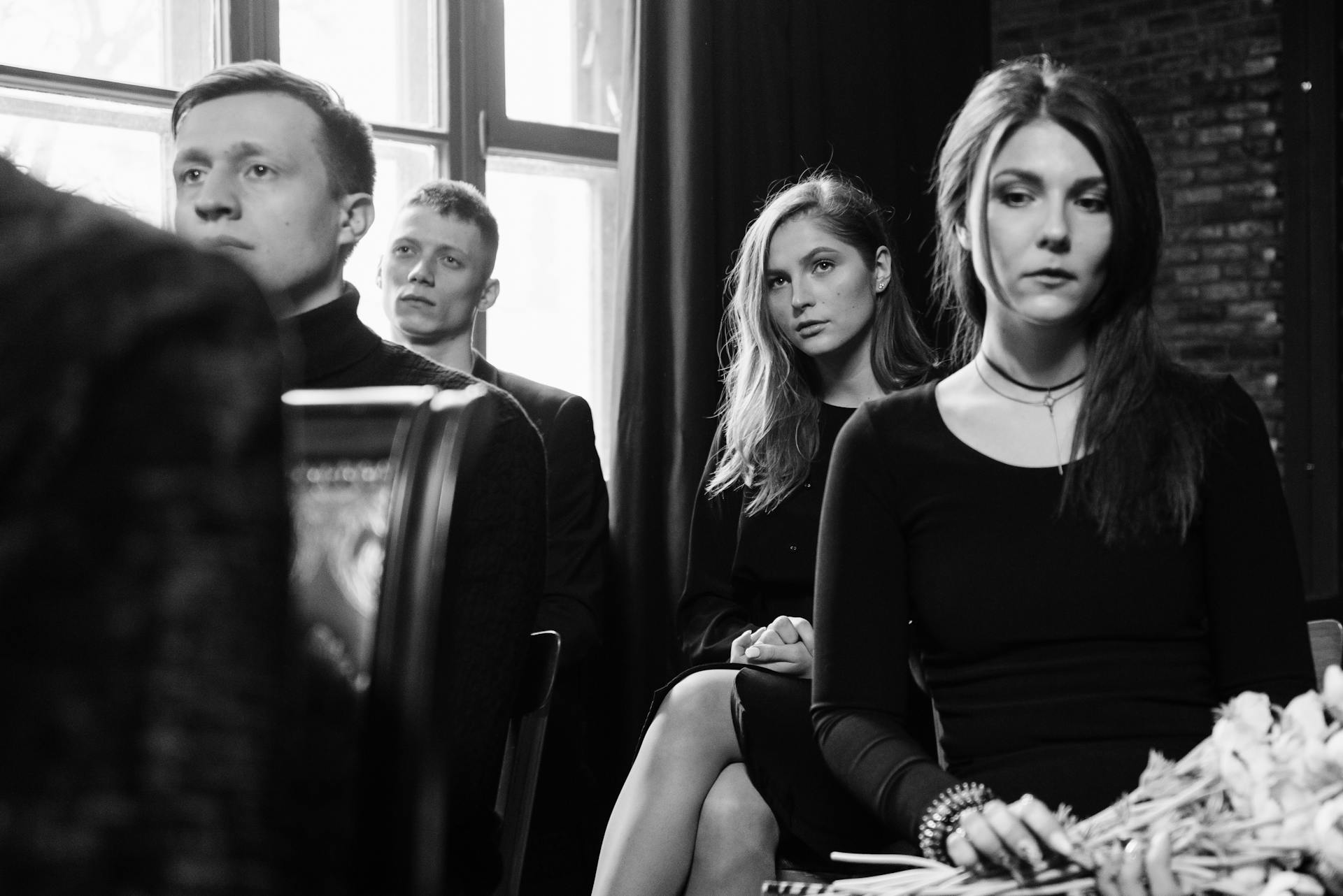 A grayscale photo of people attending a funeral | Source: Pexels