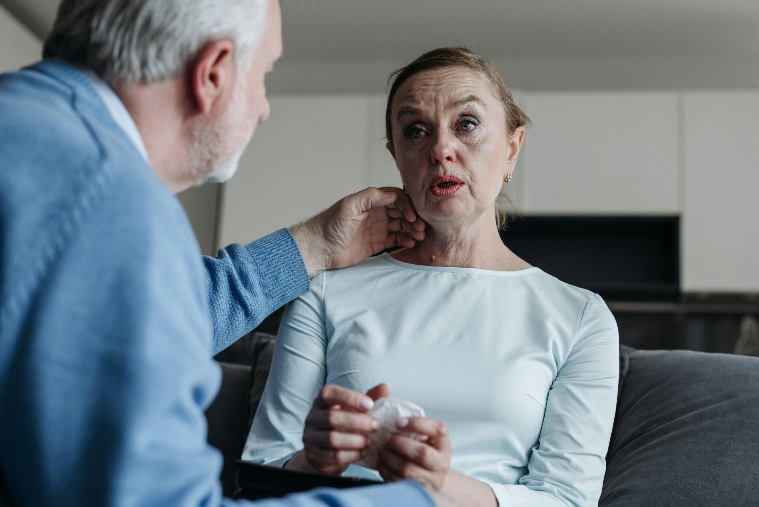 A husband comforting his crying wife | Source: Pexels