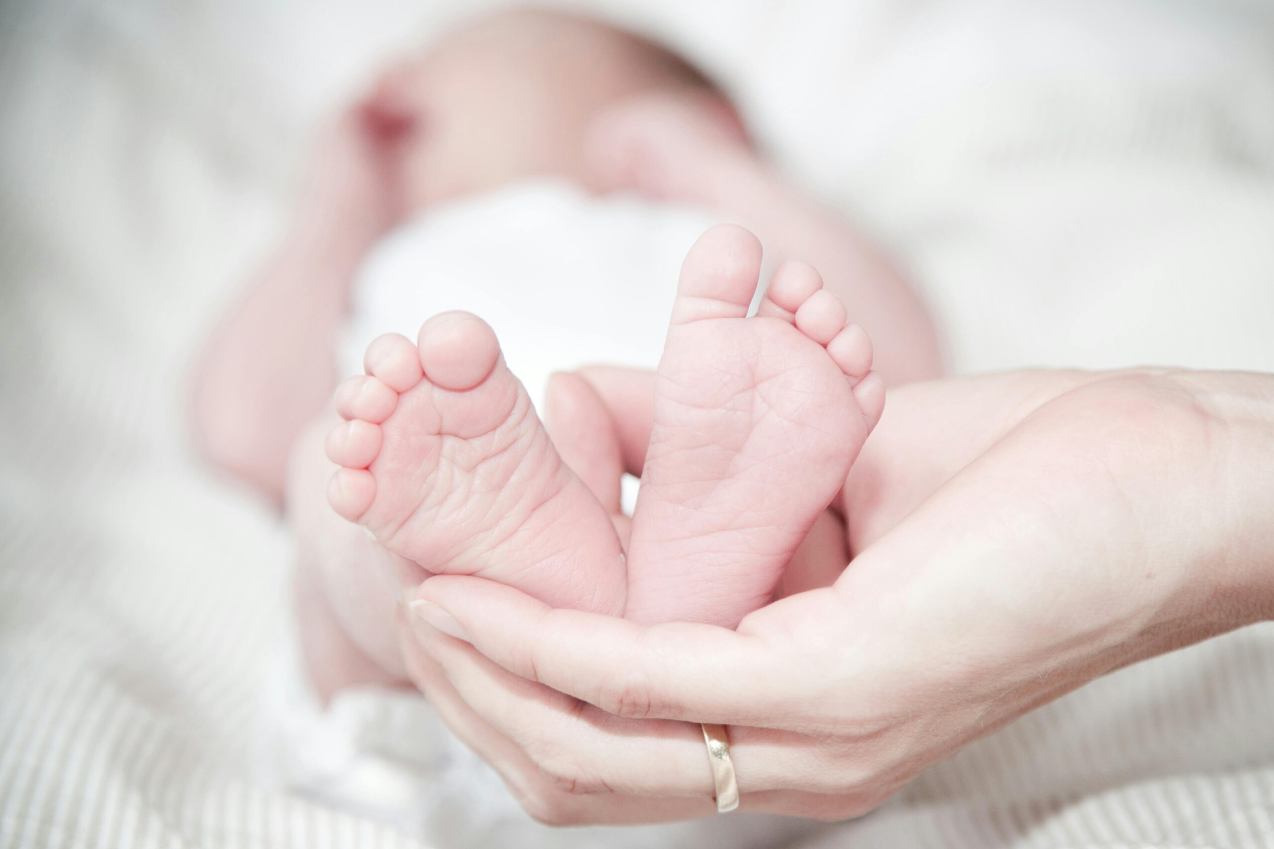 A woman holding her newborn baby