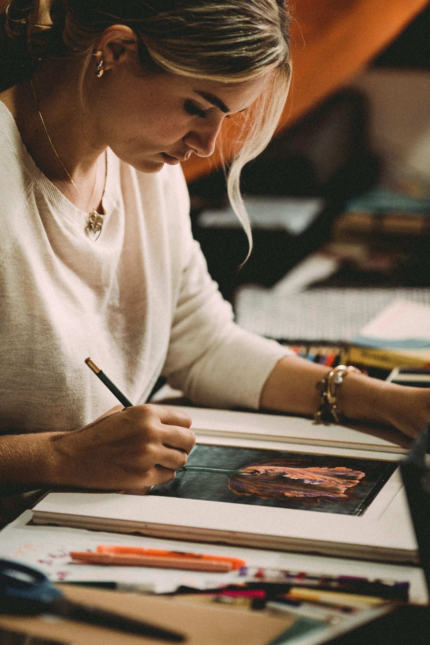 A woman working on art | Source: Unsplash