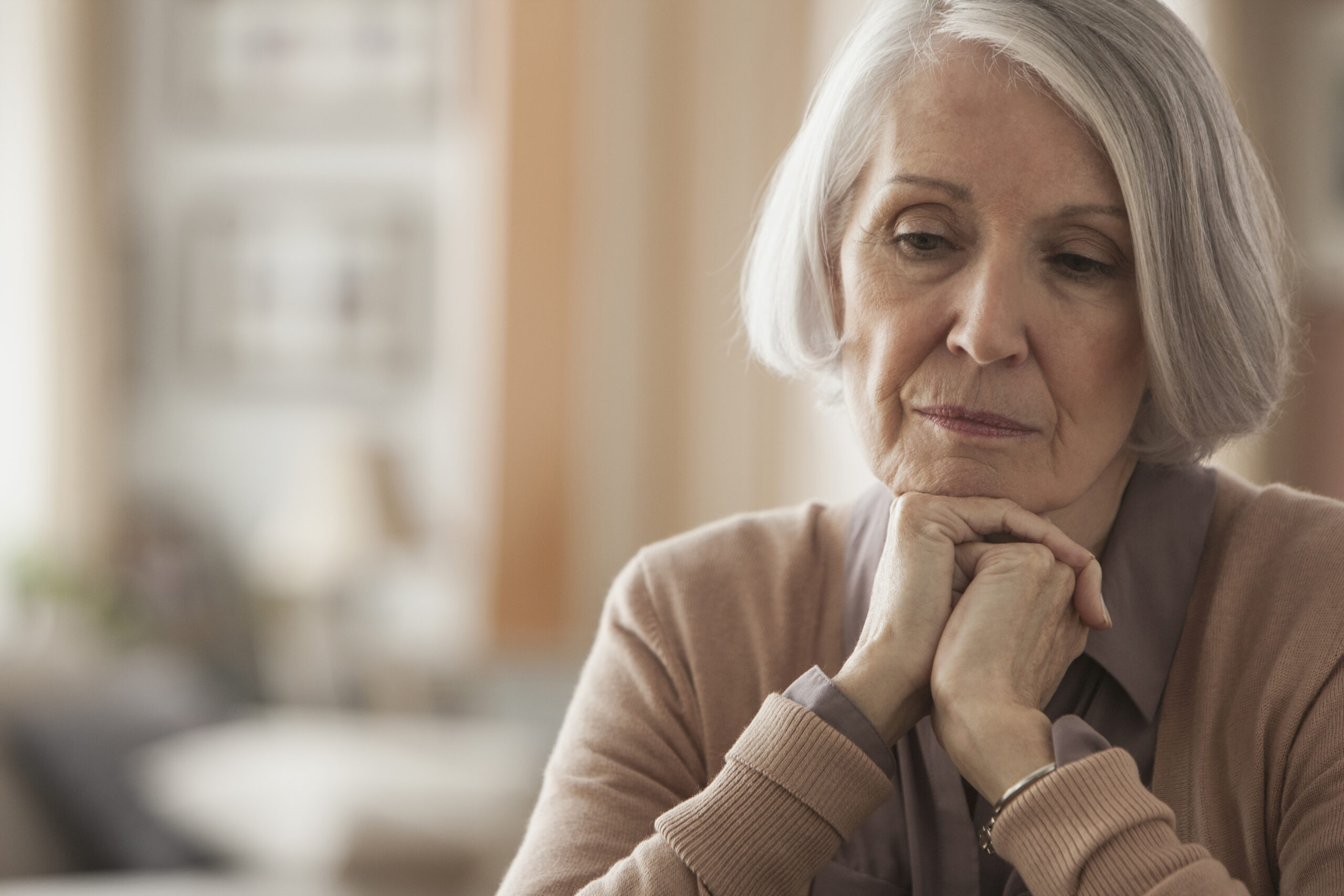 Senior Caucasian woman with chin in hands | Source: Getty Images