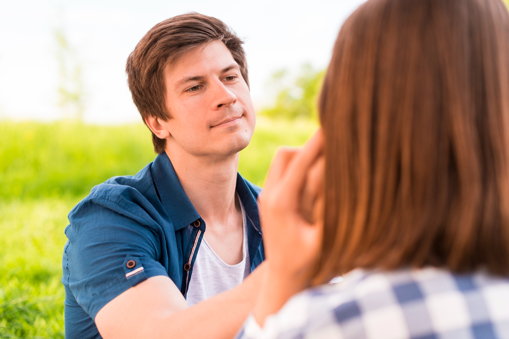 A man being sincere while touching his partner