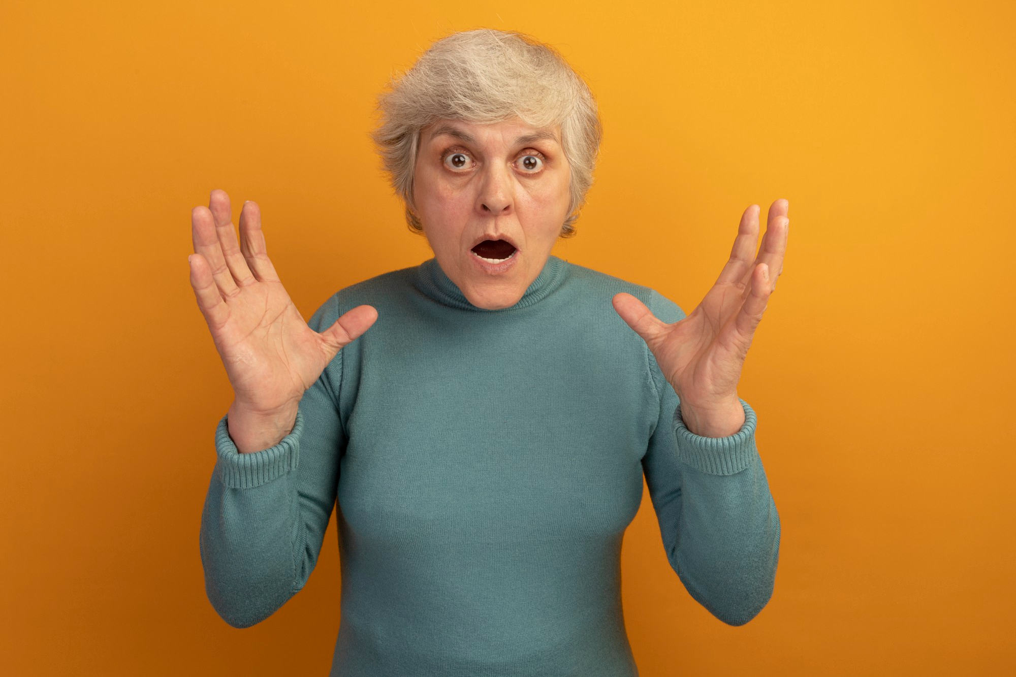 A woman reacting in shock | Source: Freepik