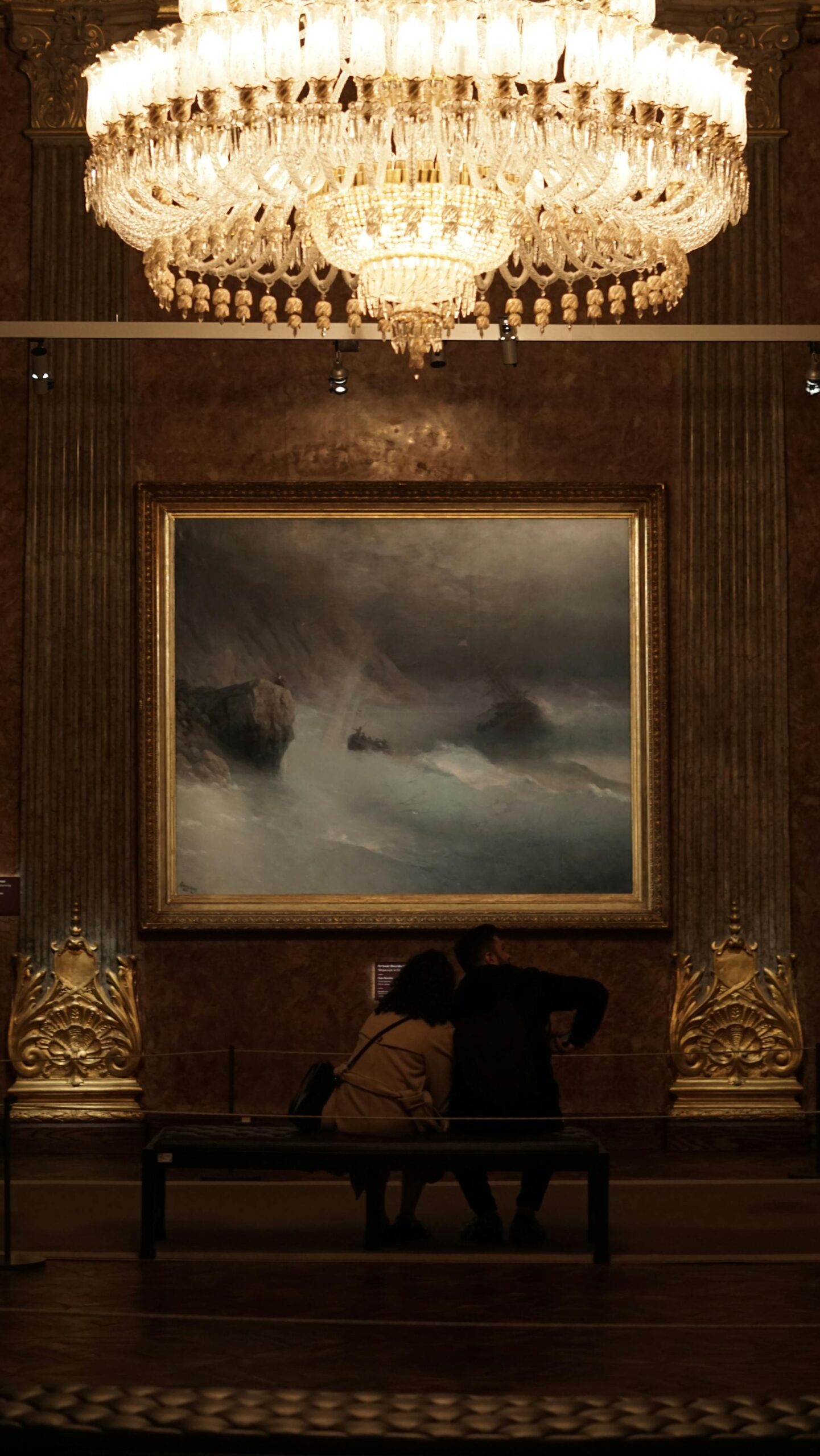 A couple sitting in a museum | Source: Pexels