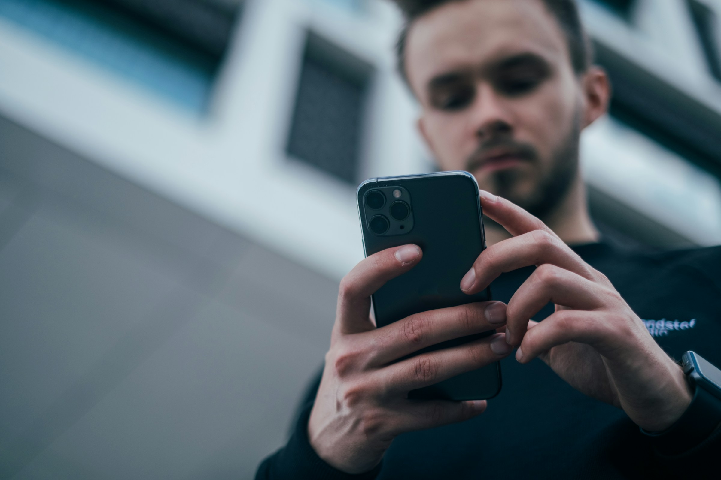 A man using his phone | Source: Unsplash