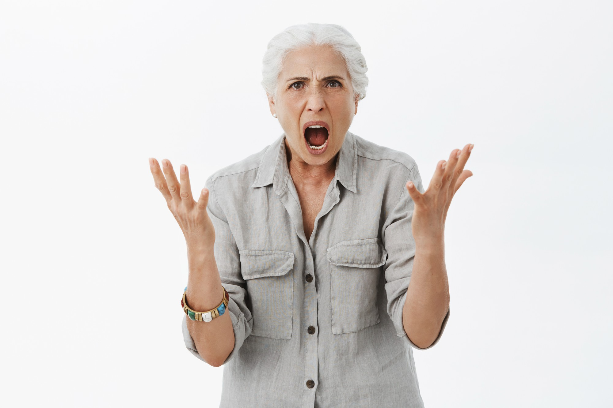 A woman gesturing in anger | Source: Freepik