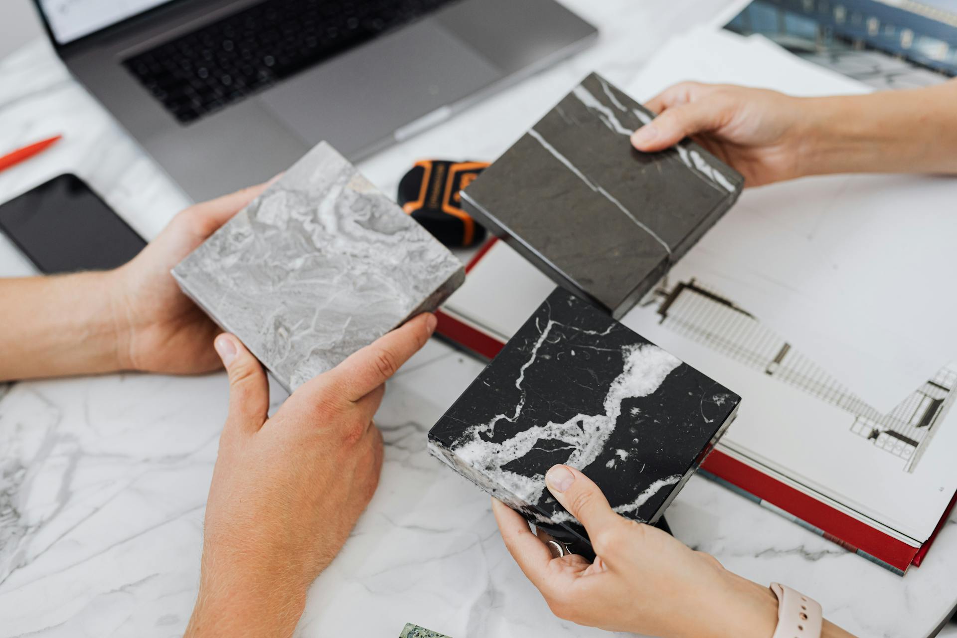 People holding tile samples | Source: Pexels