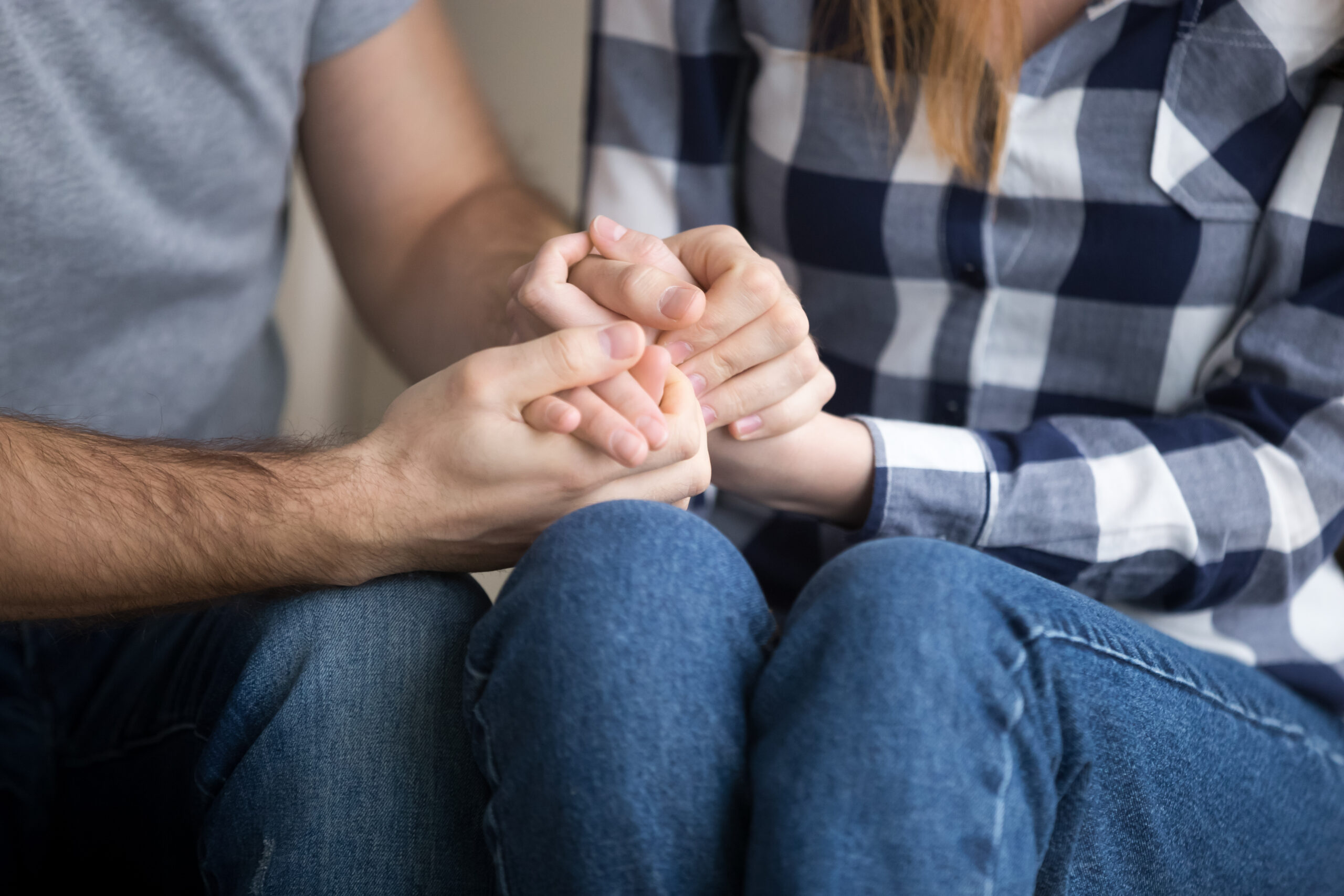 A couple reconciling while holding hands | Source: Getty Images