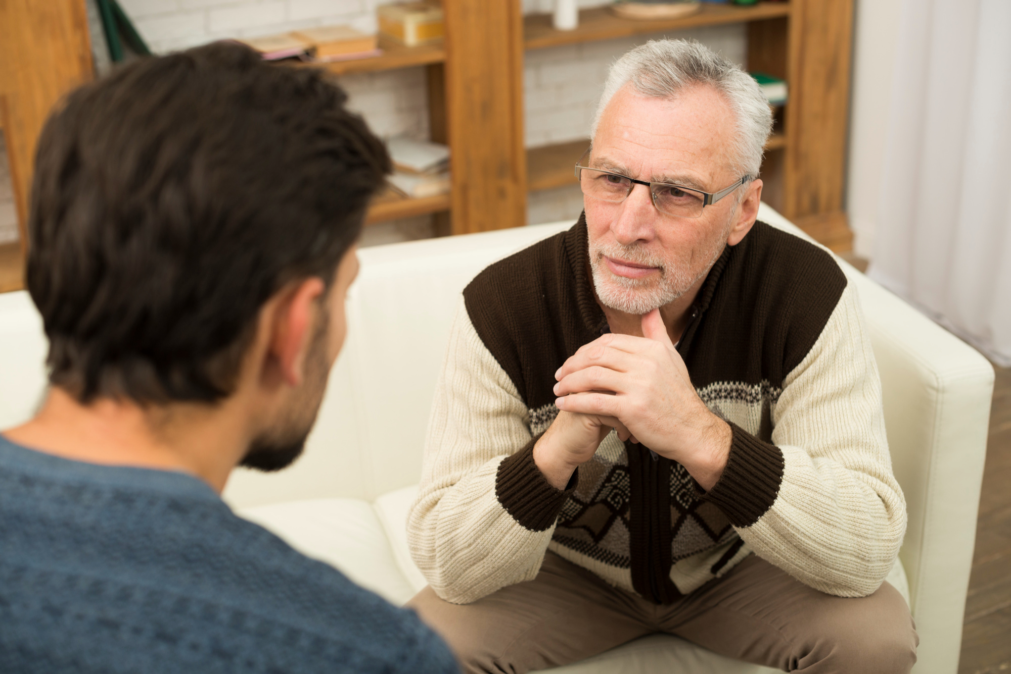 An older man and younger one conversation | Source: Freepik