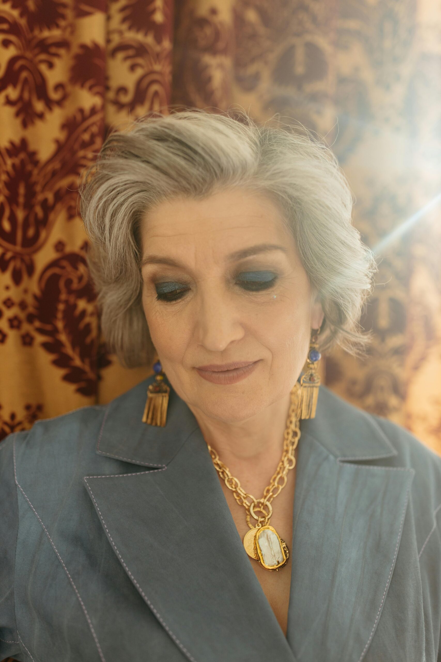 A remorseful-looking woman facing down | Source: Pexels