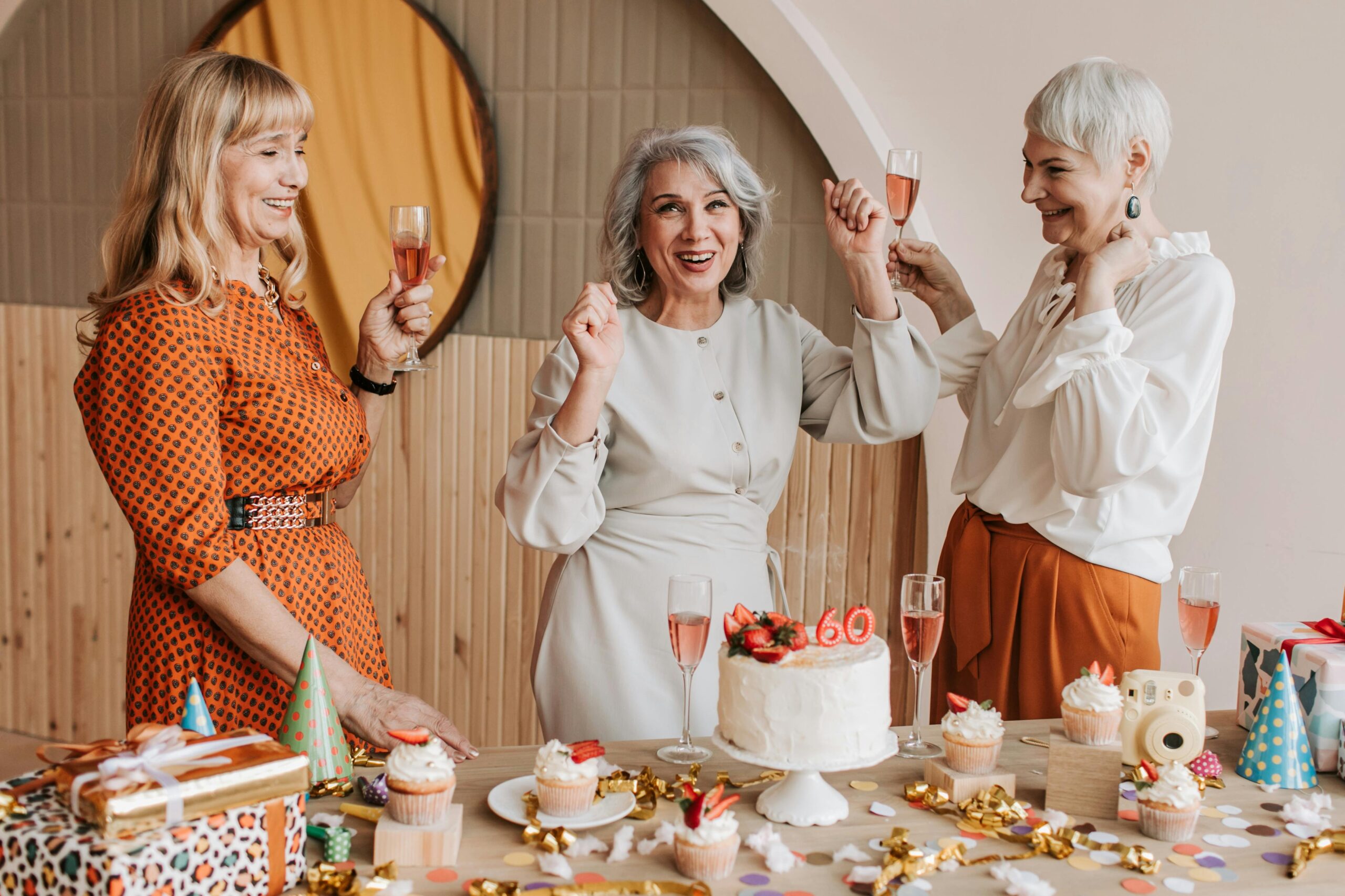 Three women celebrating a birthday | Source: Pexels