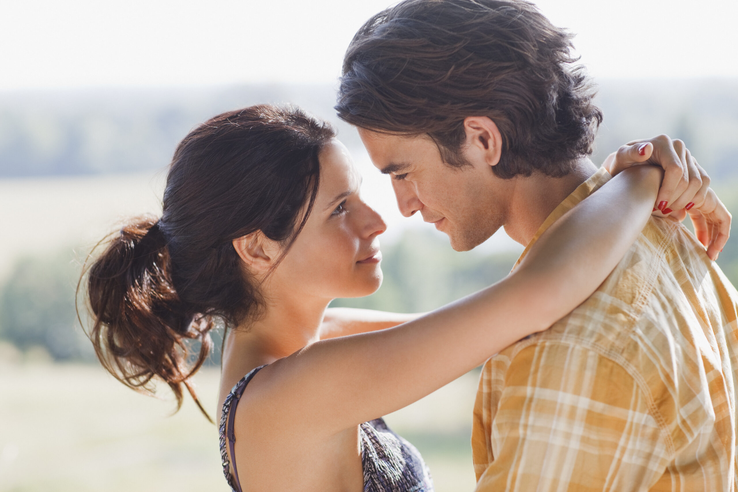 A happy woman hugging a man | Source: Getty Images