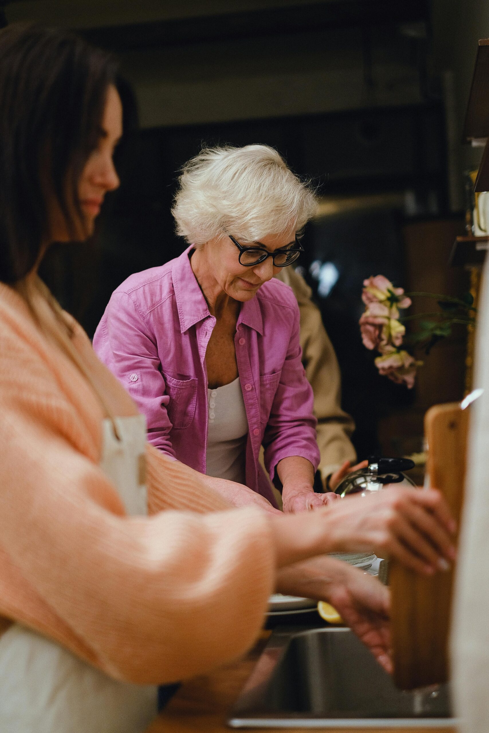 A younger and older woman in the kitchen preparing a meal | Source: Pexels